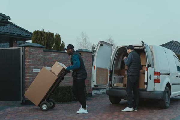 two men unloading a moving van